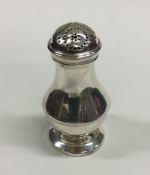 A George III silver pepper of baluster form. Londo