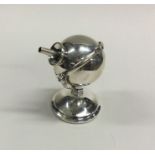 An Edwardian silver rotating lighter in the form o