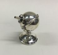 An Edwardian silver rotating lighter in the form o