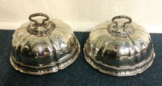 A rare pair of George III Royal Garter silver dish covers with