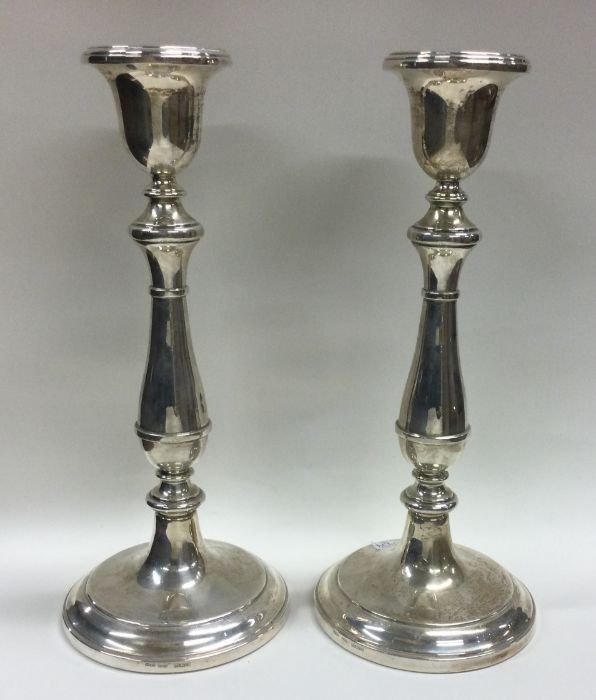 A tall pair of Georgian style silver candlesticks. - Image 2 of 2