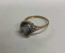 A 9 carat single stone ring in claw mount. Approx.