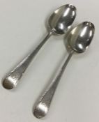 A pair of heavy Georgian silver tablespoons with f