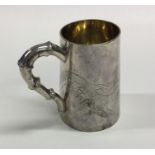 A good Chinese silver tapering mug with dragon dec