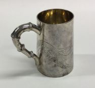 A good Chinese silver tapering mug with dragon dec