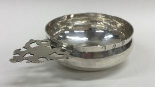 A rare William III silver bleeding bowl with pi