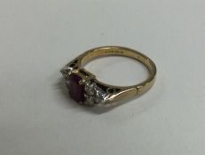 An attractive ruby and diamond seven stone ring in