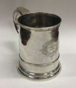 A good George II tapering silver tankard with cres