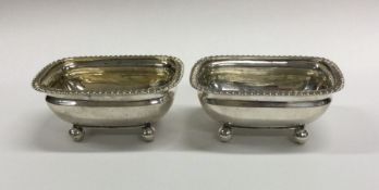 A heavy pair of Georgian silver salts with gadroon
