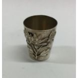 A cast Chinese silver spirit tot of tapering form.