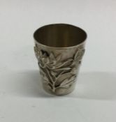 A cast Chinese silver spirit tot of tapering form.