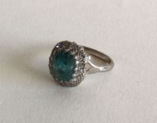 A large Zircon and diamond cluster ring in 18 cara