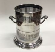 A stylish silver bottle cooler with pierced sides