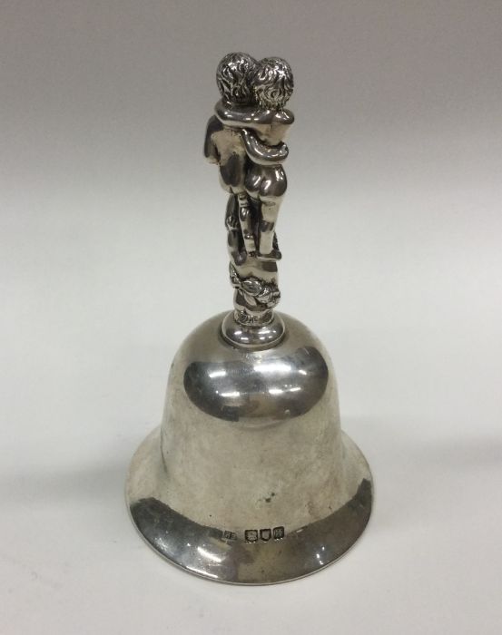 A heavy stylish silver bell decorated with childre - Image 2 of 2