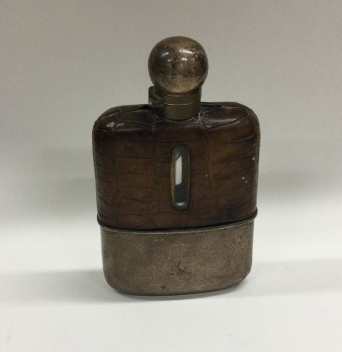 A silver and crocodile skin hip flask with crested