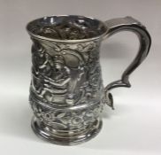 A heavy Georgian silver tankard attractively decor