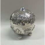 An unusual silver string box with embossed flowers