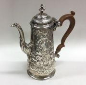 A chased George III tapering silver coffee pot pro