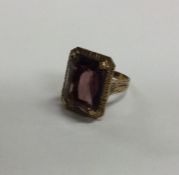 A heavy 9 carat amethyst single stone ring. Approx