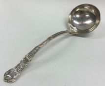 A heavy large Edwardian silver ladle with shell de