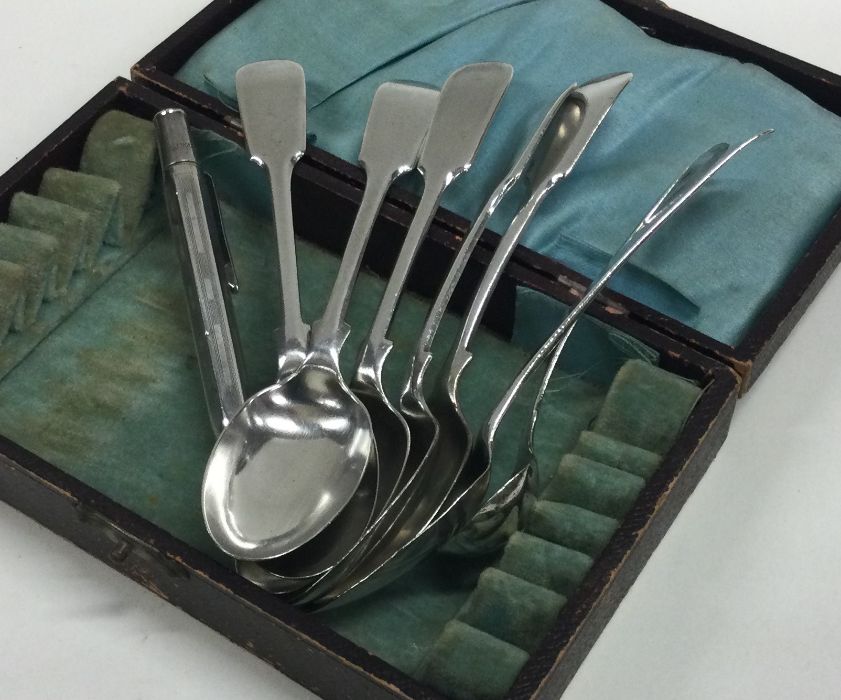 A collection of silver spoons together with an exp