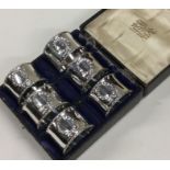 A good set of six silver napkin rings with swag de