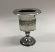 A silver Judaica candle holder with floral decorat