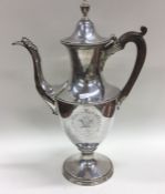 A large fine George III silver coffee pot with eng