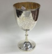 A Japanese silver goblet decorated with flowers an