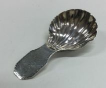 A Georgian silver caddy spoon with fluted bowl. Lo