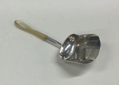 A George III bright cut silver and MOP caddy scoop