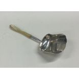 A George III bright cut silver and MOP caddy scoop