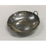 WANG HING: A Chinese silver dish of shaped form. A