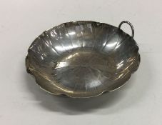 WANG HING: A Chinese silver dish of shaped form. A