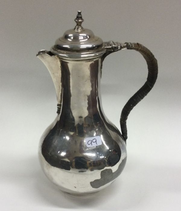 A heavy Georgian silver baluster shaped ewer with