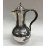 A heavy Georgian silver baluster shaped ewer with