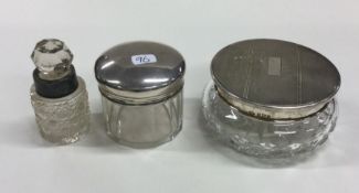 A group of three silver mounted dressing table jar