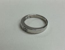 A good plain 18 carat white gold ring set with dia