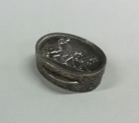 A heavy oval silver pill box mounted with lions. A