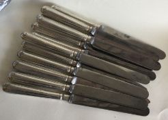 A good set of twelve Georgian silver table knives.