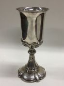 A French chased silver goblet cast with flowers an