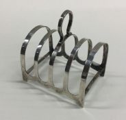 A heavy silver five bar toast rack. Sheffield. By