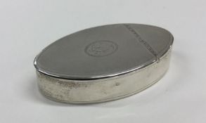 A large oval shaped hinged top silver snuff box wi