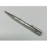 A good engine turned silver pencil. Approx. 29 gra