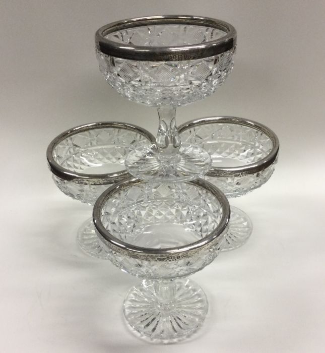 A set of four silver and glass mounted sundae dish