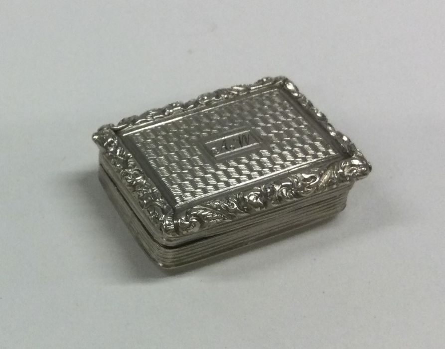 A George III silver vinaigrette with chased decora