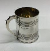 A George III silver christening mug with reeded bo