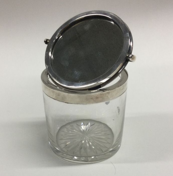 A cylindrical hinged top glass box with rotating m - Image 2 of 2