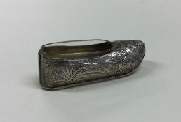 A Chinese silver model of a shoe of typical form.