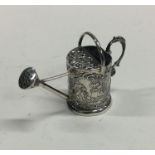 A novelty miniature silver watering can decorated